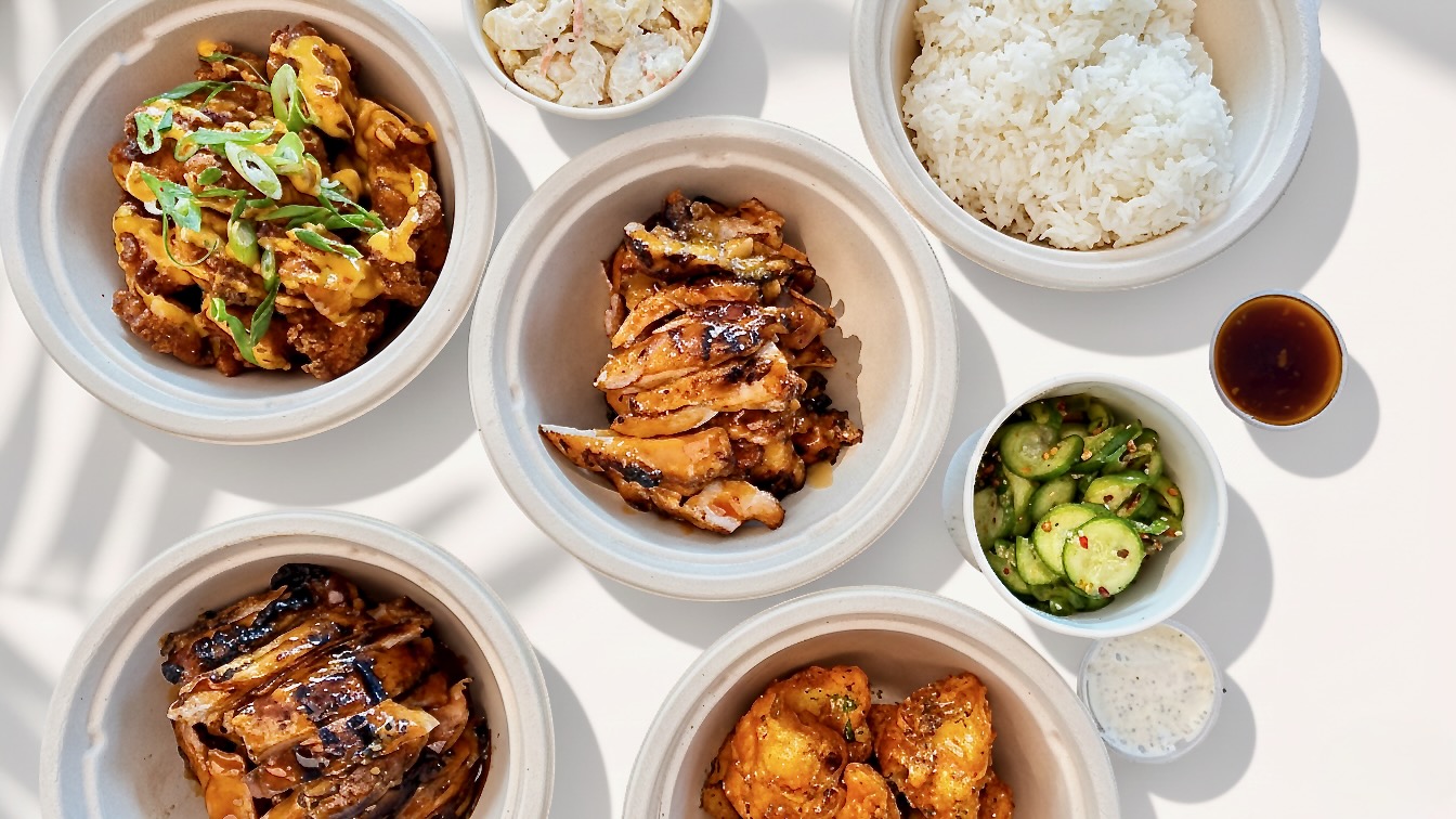 Grillbird menu spread — multiple dishes overhead