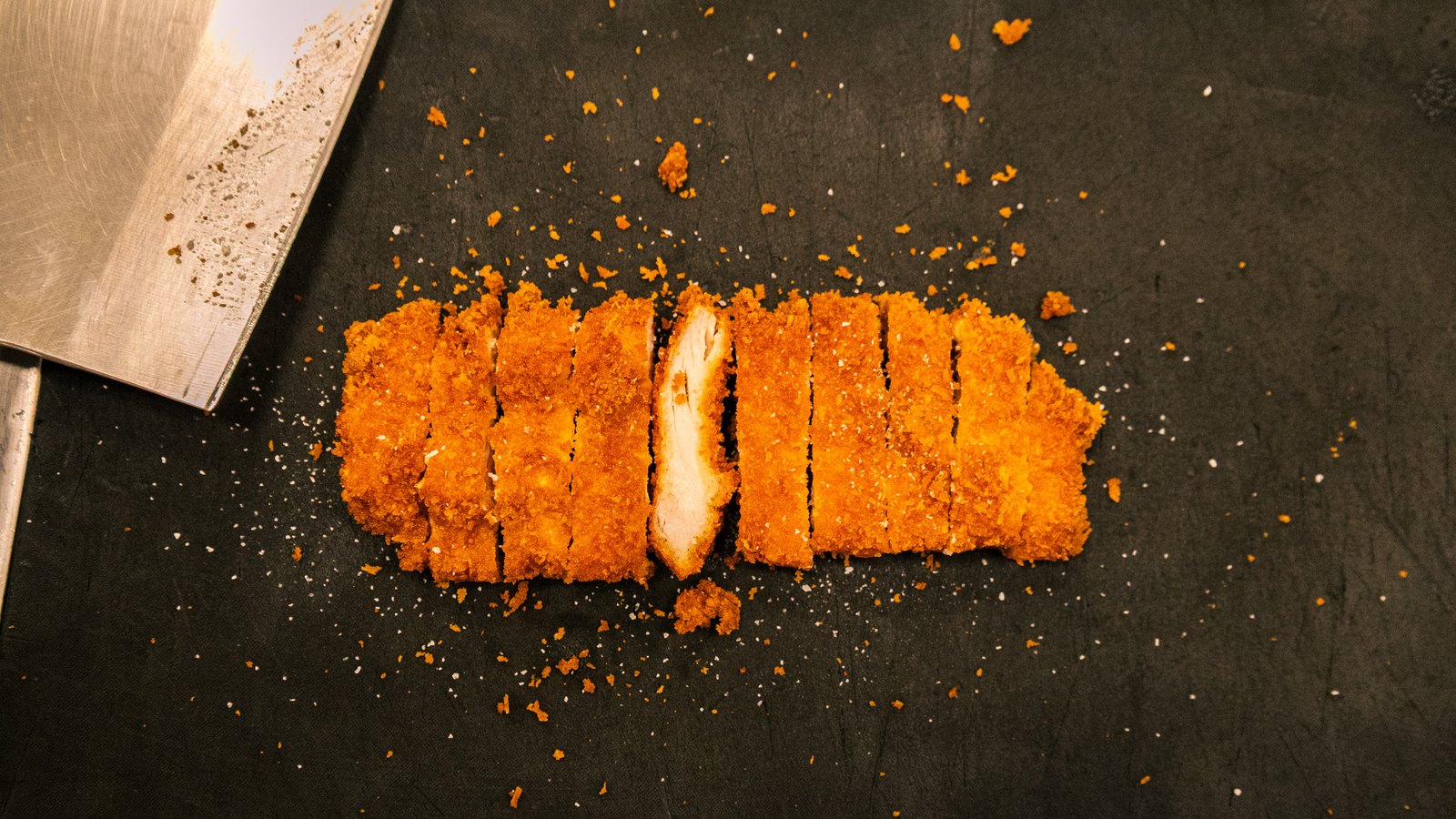Grillbird chicken katsu sliced on a board